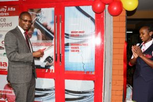  Chief Guest, Equity Bank Kenya Chairman Prof. Isaac Muthure Macharia, cuts the ribbon